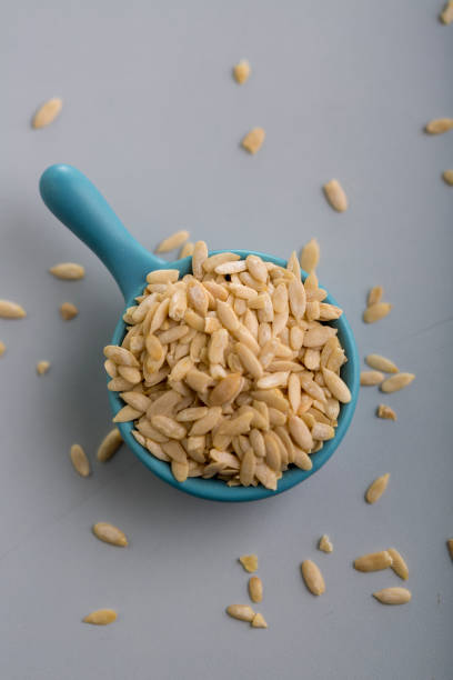 istock Dry Melon seeds in a  small cup 1195579274