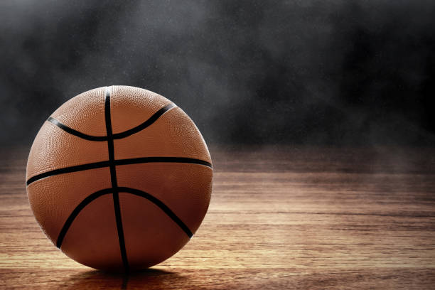 istock Basketball ball on black background 1195580048