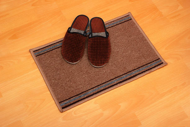 istock Home slippers with small carpet on the floor 1195580184