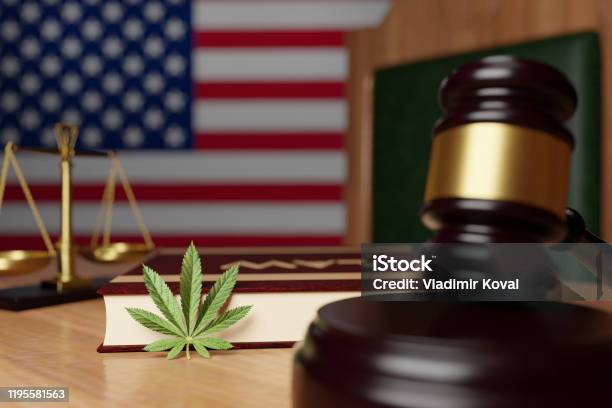 Legalization Of Cannabis In The United States The Hammer Of The Judge The Scales Of Justice The Book With The Inscription Law And Cannabis Leaf Lie On The Desktop Of The Judge On The Background Stock Photo - Download Image Now