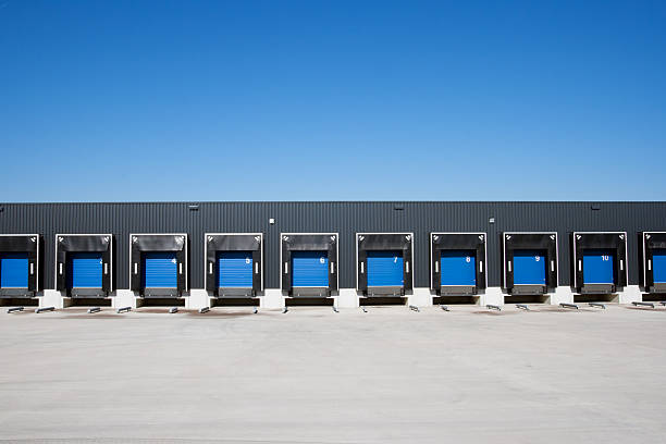 istock Row of loading blue dock entrances against blue sky 119558456