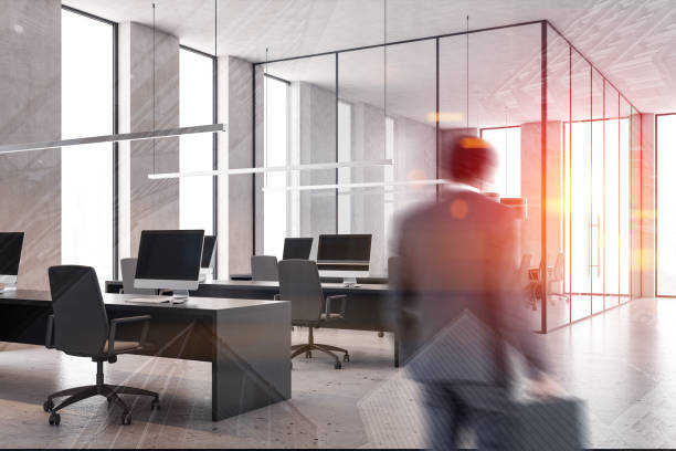 istock Businessman entering white open space office 1195584594