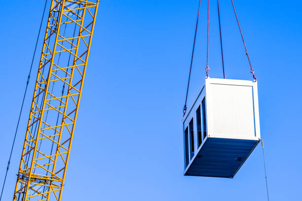mobile office at a crane mobile office at a crane in front of blue sky prefabricated building stock pictures, royalty-free photos & images