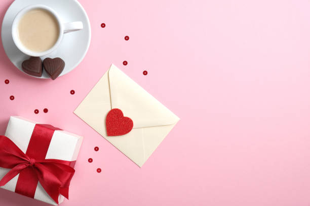 istock Happy Valentine's Day concept. Flatlay composition with gift box, romantic love letter, Valentine heart and coffee cup. Flat lay, top view, copy space. 1195585771