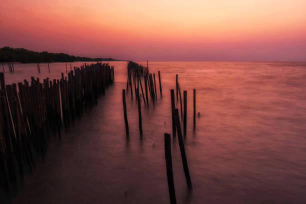 Motion seascape with twilight sky at dawn in Samut Songkhram, Thailand. Natural landscape background with copy space for text. Big stopper filter for long exposure landscape.