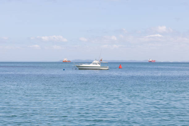 Boat in the middle of natural pools in the ocean. Morro de Sao Paulo, Salvador, Brazil. Hill.