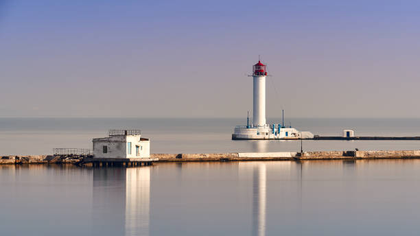 istock Sea lighthouse near cargo port 1195586418