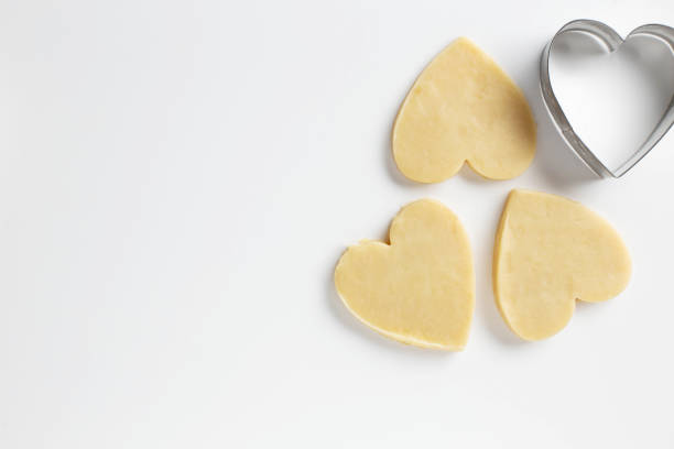 istock Cookie Cutter with heart shaped Cookie dough 1195590416