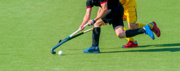 istock Low Section Of Men Playing Hockey 1195590426