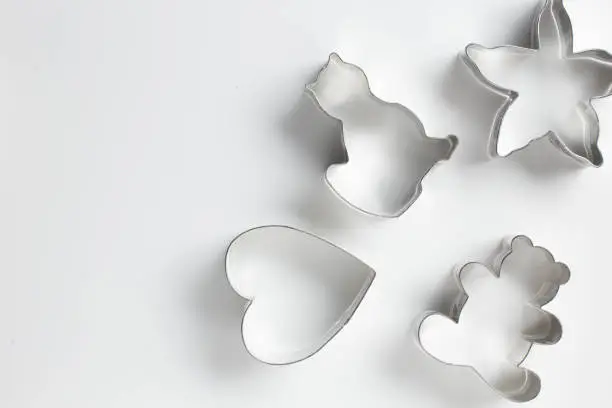 Heart shaped cookie cutter, cat cookie cutter, starfish or star cookie cutter, bear cookie cutter on white background