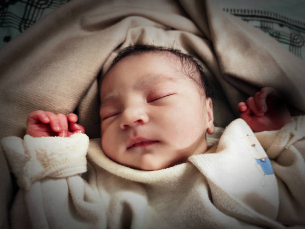 istock Sleeping newborn baby peacefully 1195591812