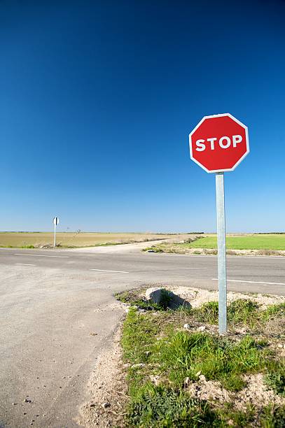 istock stop sign at crossroads 119559873