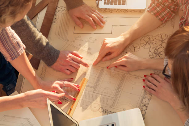 istock Team made of young architects in the sunny office. 1195601559