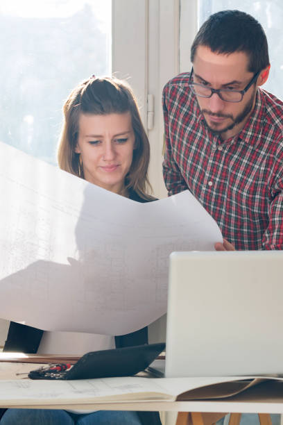 istock Team made of young architects in the sunny office. 1195601655
