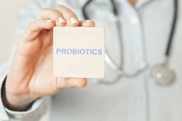Doctor advises. Medical worker holds PROBIOTICS sign, healthy lifestyle concept. Doctor advises. Medical worker holds PROBIOTICS sign, healthy lifestyle concept. probiotic photos stock pictures, royalty-free photos & images