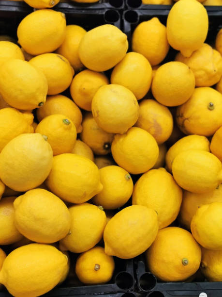 istock Ripe lemons in a box 1195605328