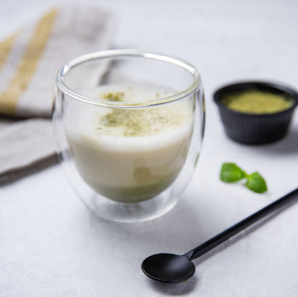 istock green matcha tea in transparent glass on white background 1195607549