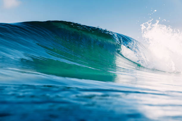 istock Blue crystal wave in ocean. Breaking wave and sun light 1195607839