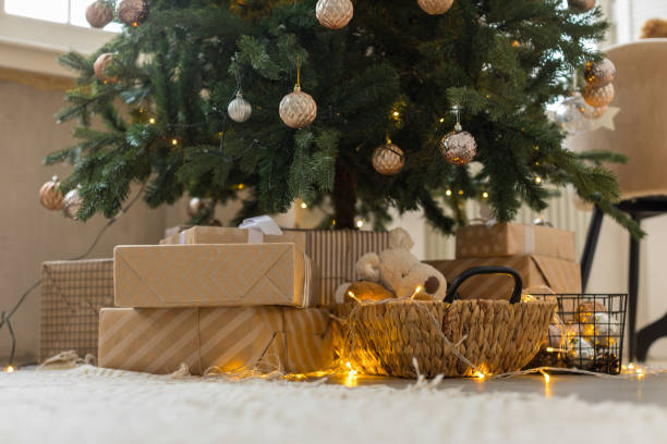 istock Gifts and burning garland under Christmas tree 1195611357
