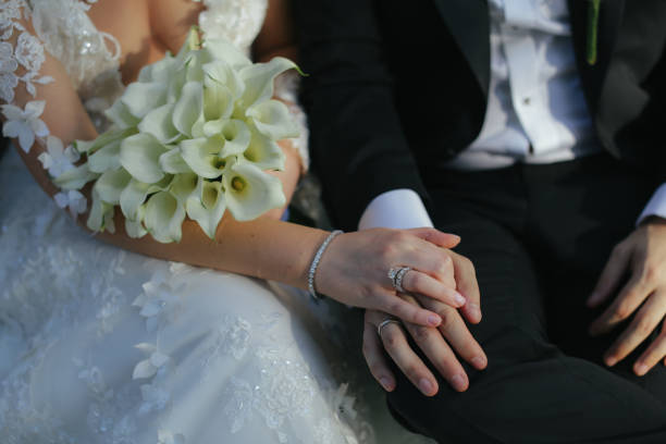 closeup groom and bride are holding hands at wedding day ang show rings - women bride personal accessory adult imagens e fotografias de stock