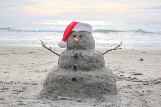 A sand snowman in Encinitas California stock photo