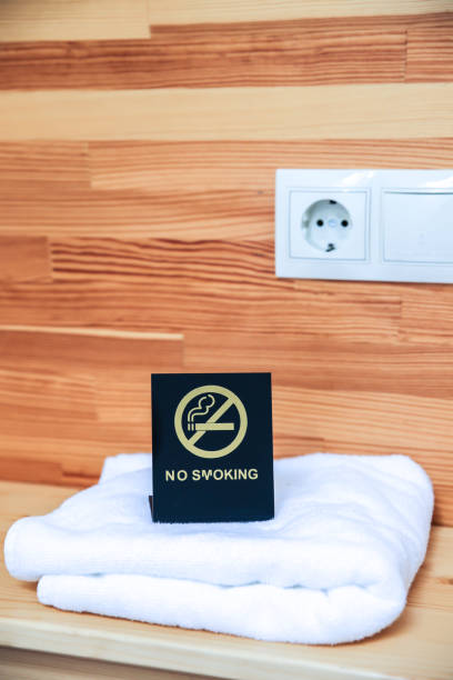 istock No smoking sign on the bedside table. Hotel towels. 1195614241