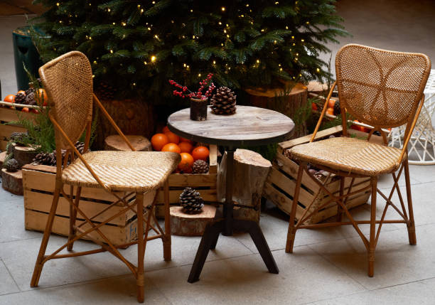 istock Christmas tree with festive table with mandarins, oranges and pine tree cone 1195615311
