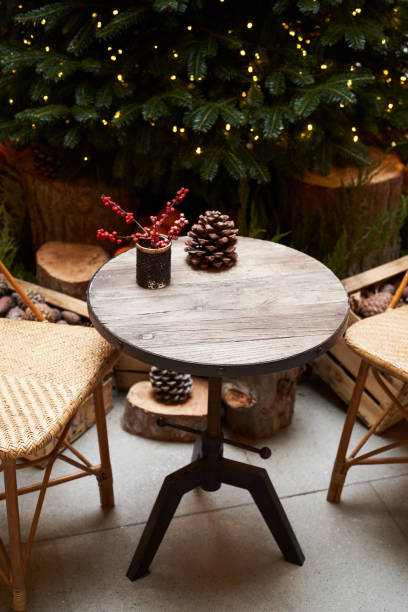 istock Christmas tree with festive table with mandarins, oranges and pine tree cone 1195615316