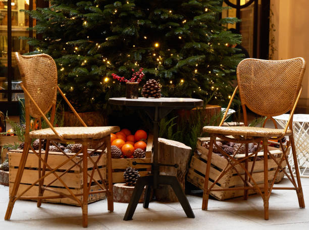istock Christmas tree with festive table with mandarins, oranges and pine tree cone 1195615336