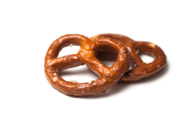 istock two salted pretzels on white background 1195616672