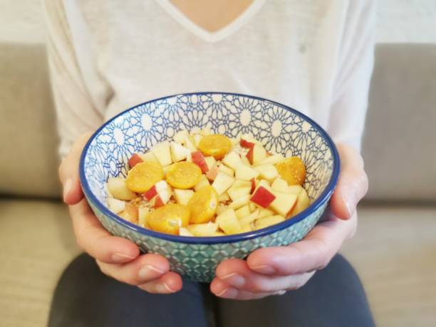 Healthy breakfast alternative warm porridge with fruits being presented for picture