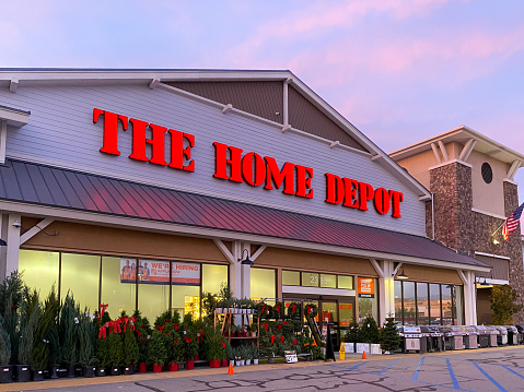 The Home Depot store entrance with colorful sunset in the background in Irvine, California, USA. Largest home improvement retailer and construction service in the US.