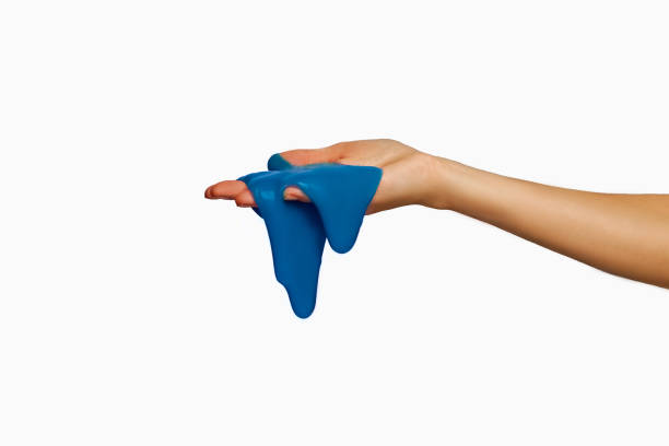 istock Blue slime in hand, isolated on white. 1195630128
