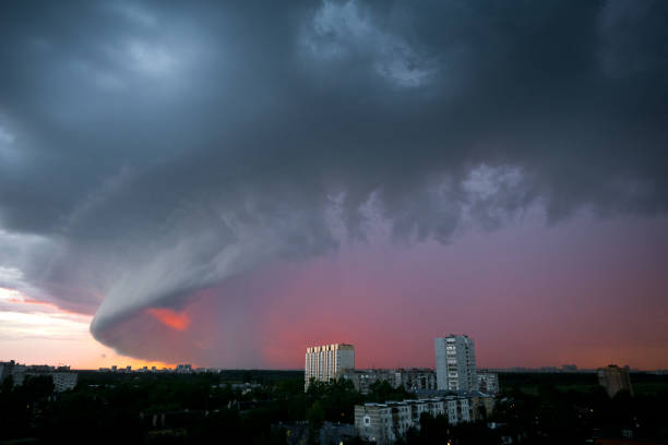 Hurricane front covers the city at sunset.