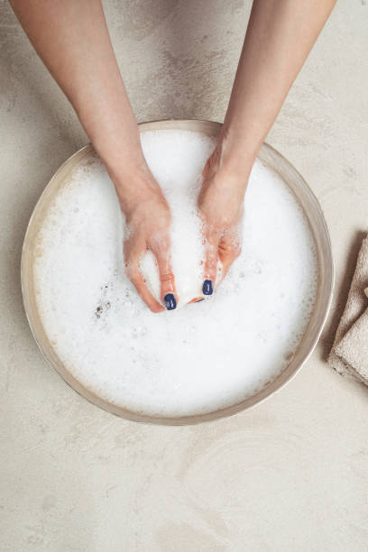 istock A Woman Holding Spa Sponge in the Water 1195633954