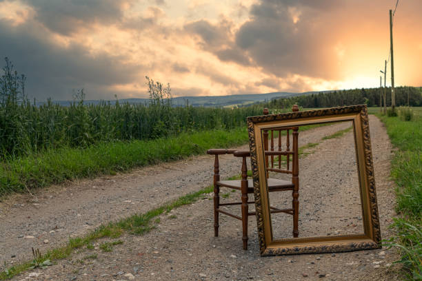 istock chair with picture frame in an idyllic sunset 1195639125