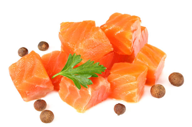 istock Red fish. Raw salmon fillet with parsley and peppercorns isolate on white background 1195643759