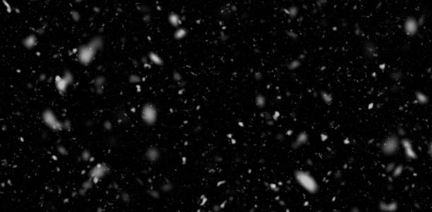istock Falling snow in the night. Snowfall in pure dark. 1195647204