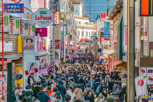 TOKYO, JAPAN, JANUARY - 2019 - Crowded urban scene at famous takeshita street, harajuku district, tokyo, japan