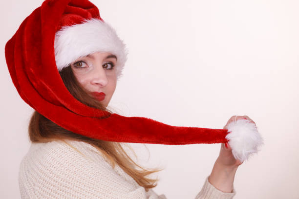 istock Beautiful girl wearing christmas cap. 1195651129