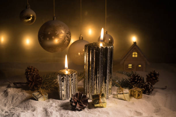 istock Creative artwork decoration. Christmas decoration with burning candles on a dark background. Christmas ornaments over dark golden background with lights. 1195651399