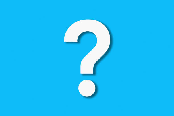 istock Question mark cut from white paper on a blue background. Cut. Ha 1195652555