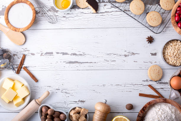 istock Baking and cooking ingredients on white wooden background 1195653593