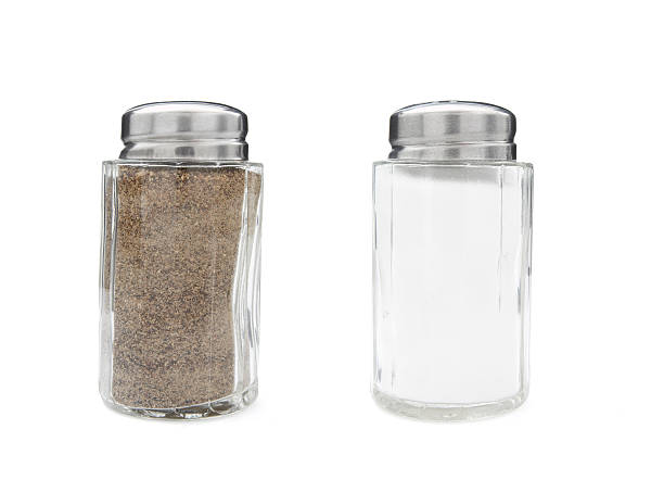 istock Full salt and pepper glass pots on white background 119565790
