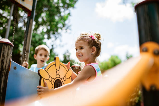 istock Kids are having fun on an outdoor playground 1195658498