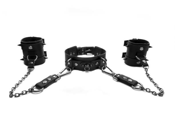 istock Black BDSM collar with spikes and leather bracelets 1195660774