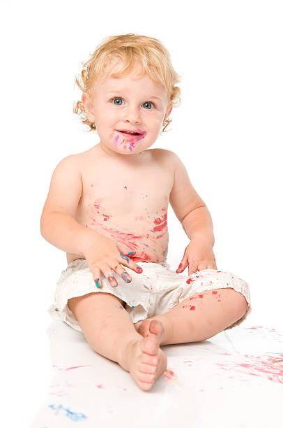 istock Smiling child playing with colors 119566300