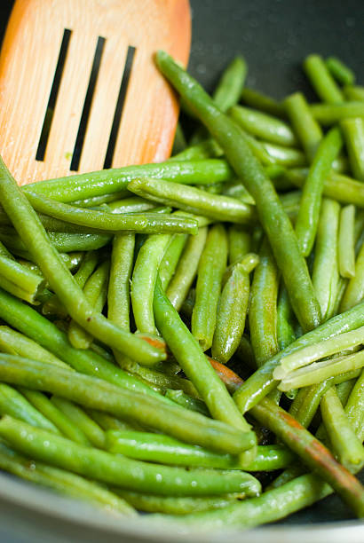 istock Fried green beans and wood utensils 119566540