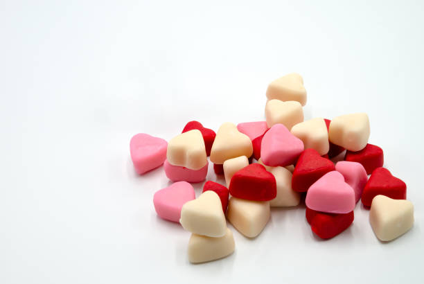 Marshmallow candy hearts on white background stock photo
