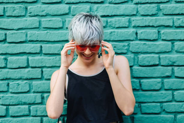 Cool girl with sunglasses posing